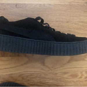 All black Puma Creeper